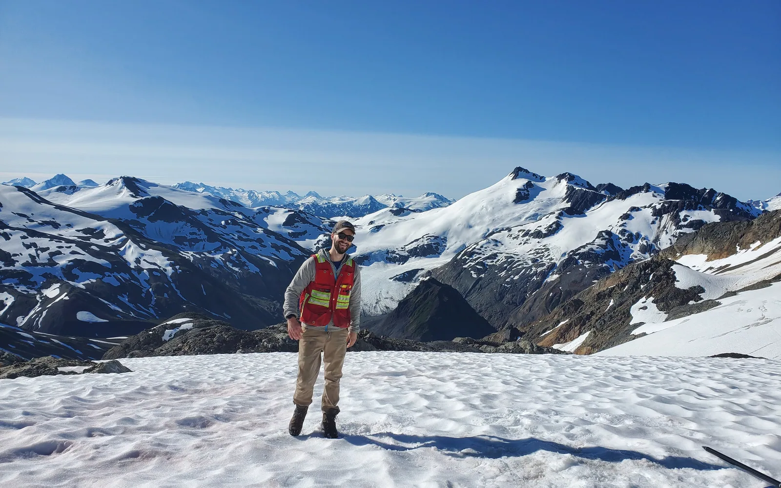 Konrad Chrzastowski conducting field work in mountainous terrain